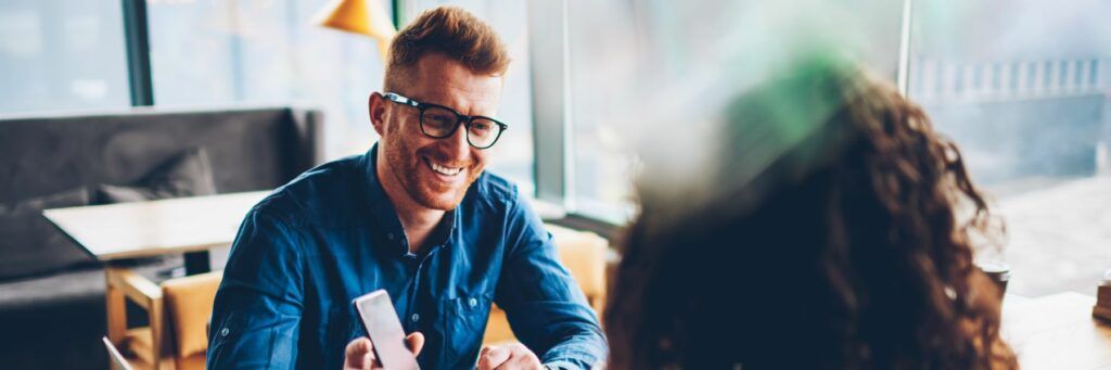 Two business partners discuss the difference of startups vs small businesses Two business partners discuss the difference of startups vs small businesses