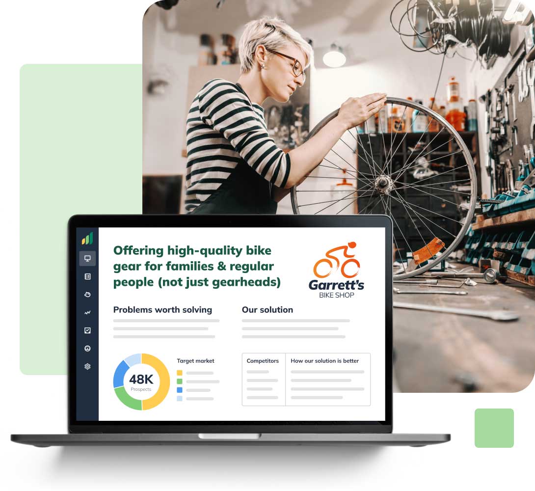 Laptop displaying a bike shop's presentation. Background shows a person repairing a bicycle wheel in a workshop.