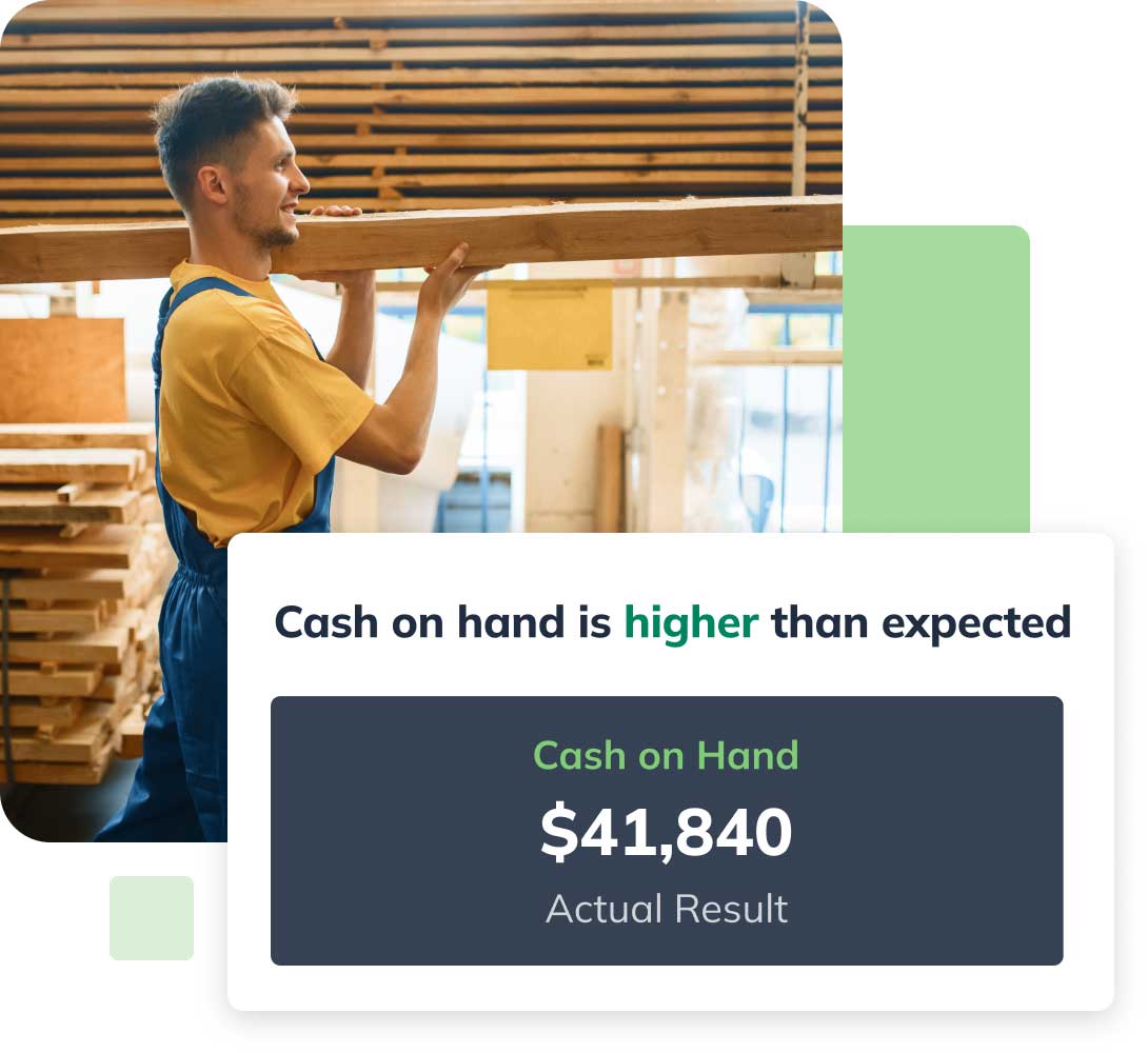 A person in a workshop carries wood planks. Overlay text shows cash on hand is higher than expected at $41,840.