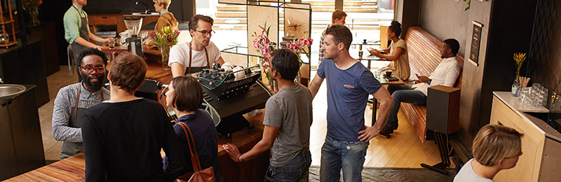 Front house of restaurant with multiple people