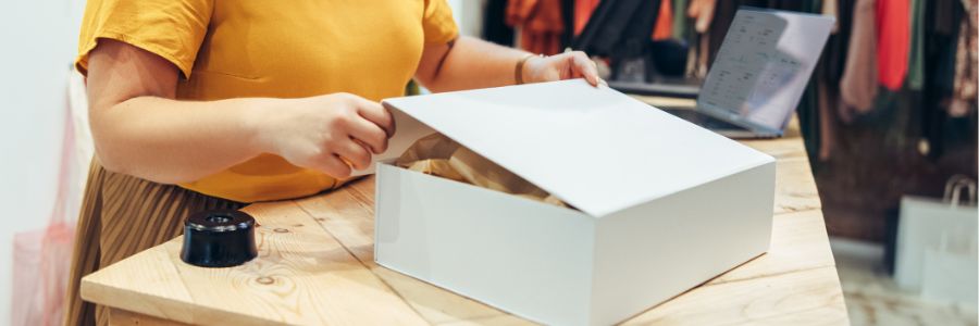 Woman closing a box