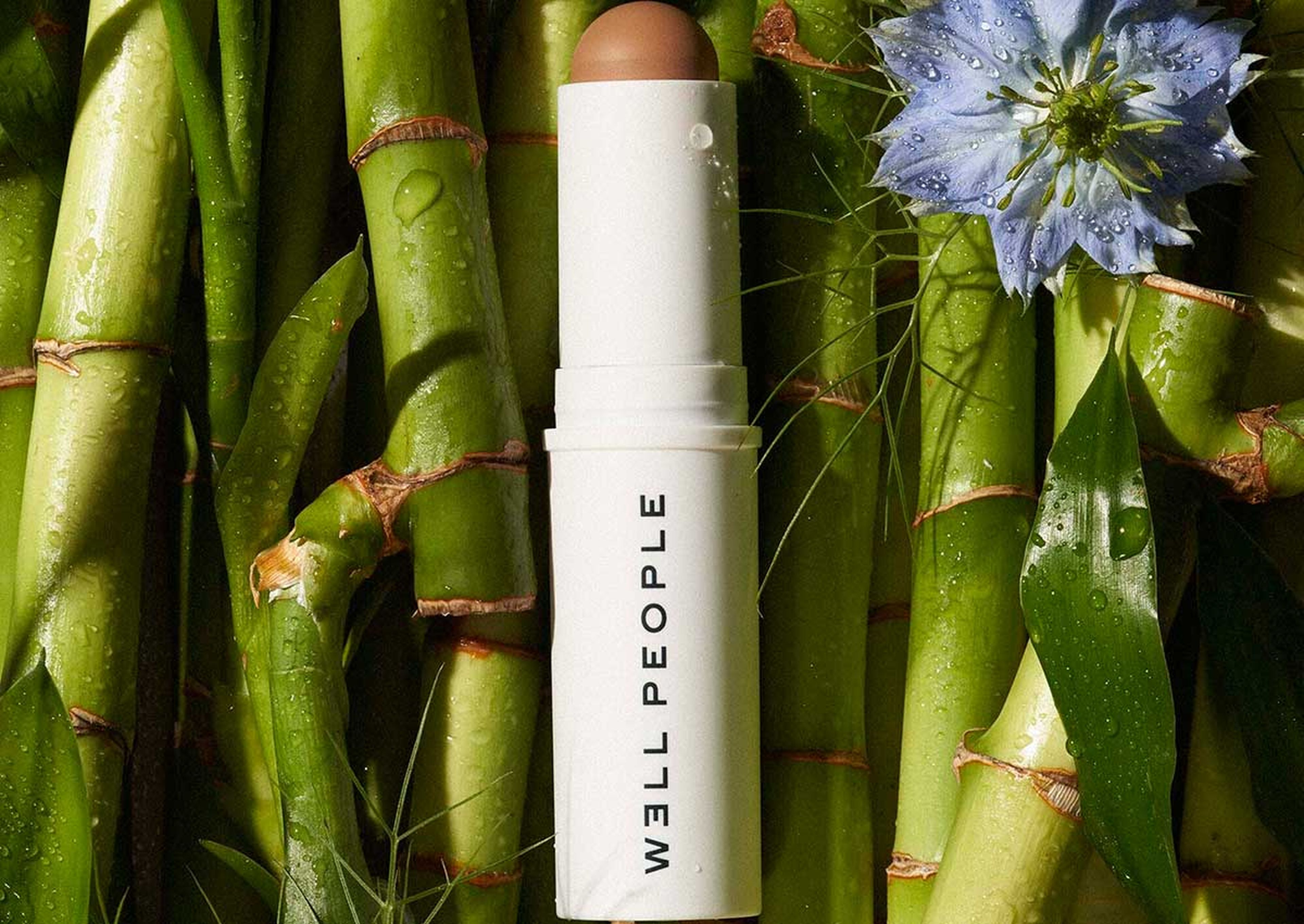 a misted well people product laying on a pile of bamboo