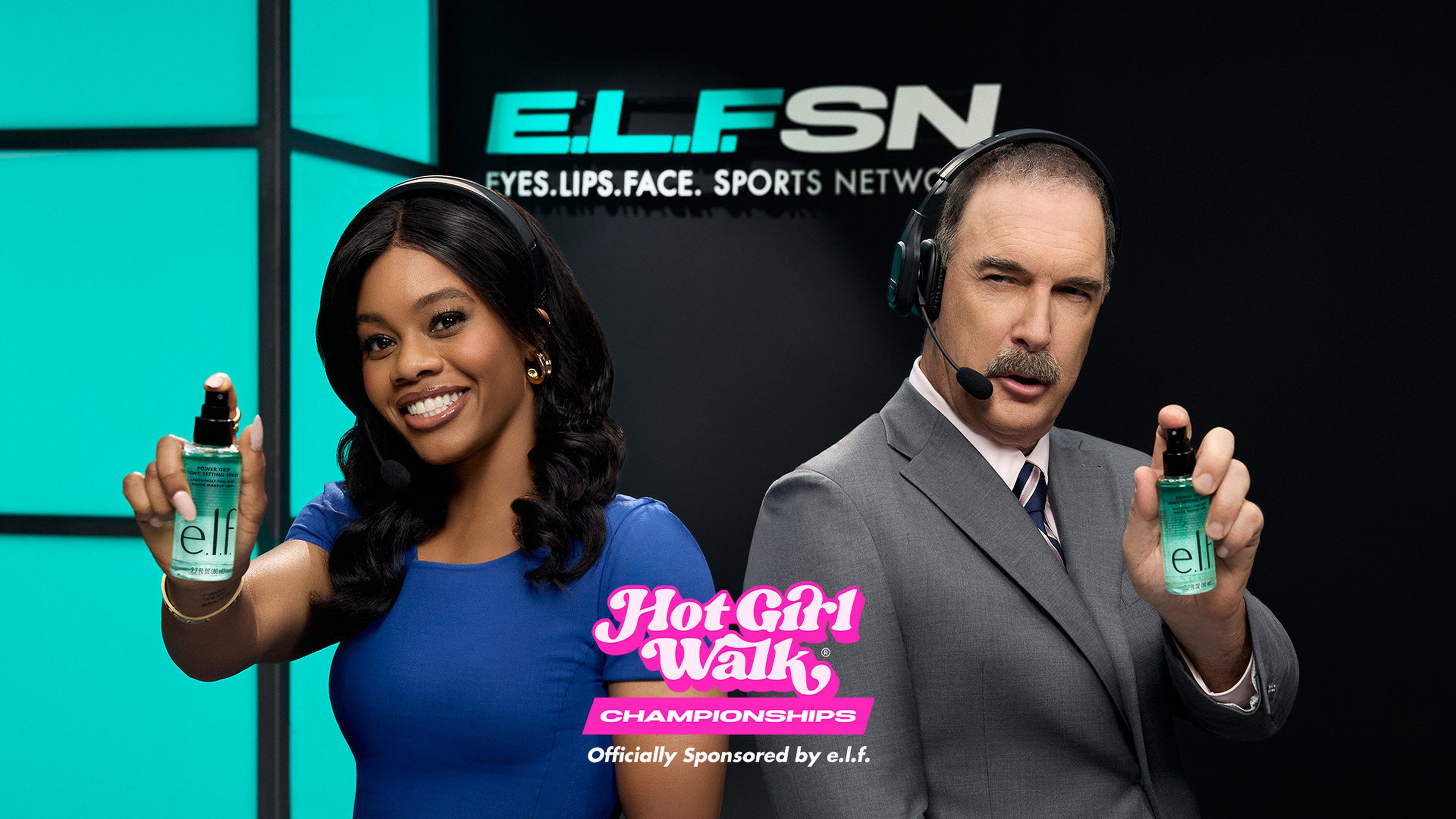 gabby douglas and patrick warburton holding up elf product