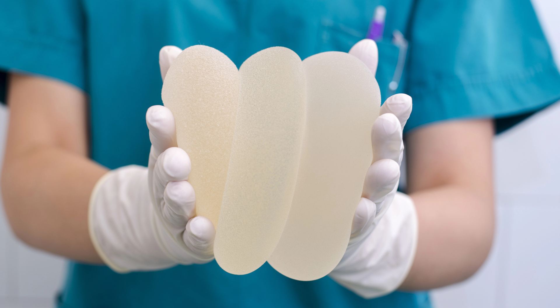 DR holding together different breast implants