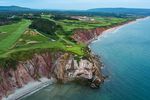 The thrilling 16th hole at Cabot Cliffs ranks among golf's greatest par-3s.
