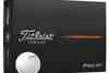 Black Titleist Pro V1 dozen box with a single ball resting in front of it