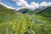 The Andermatt Swiss Alps course in the Urseren Valley, surrounded by high Alpine peaks.