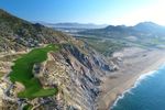 Cliffside holes where the Baja Desert meets the Pacific Ocean, cacti, dramatic rock formations sculpted by the waves, sunset in Cabo.