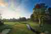 Lush tree-lined fairway on the Wentworth Club West Course in Virginia Water, Surrey