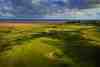 Royal Liverpool Golf Club, England - links fairways stretching along the Wirral coastline with views across the Dee estuary