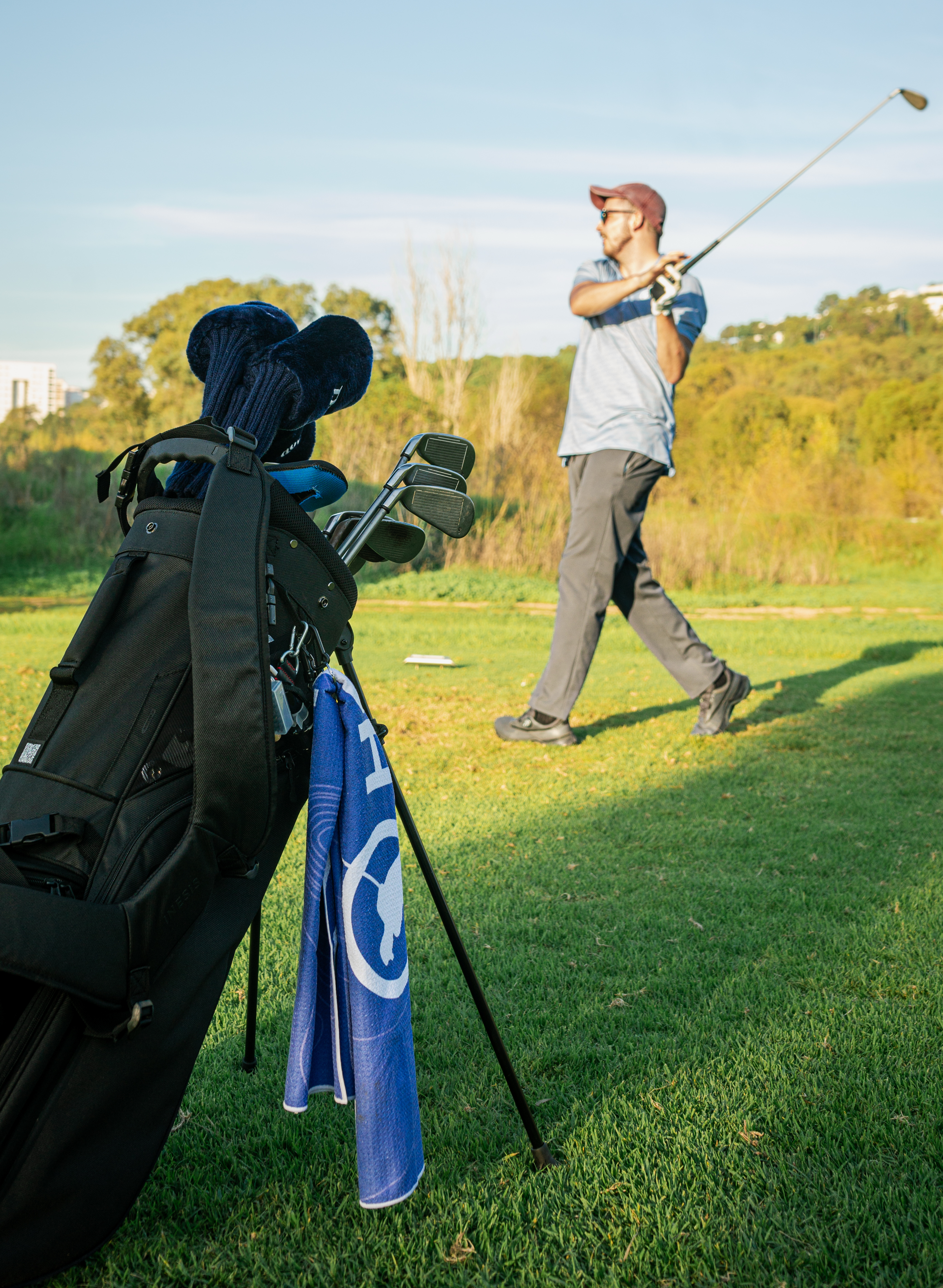 Golfer hitting an iron shot - how to control distance with irons