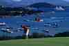 Pevero Golf Club, Costa Smeralda, Sardinia - elevated tee shot framed by dramatic granite outcrops above the emerald waters of the Costa Smeralda