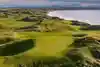 Classic links golf course with undulating fairways, fescue rough and coastal views