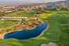 Aphrodite Hills Golf Course, Paphos, Cyprus - the spectacular par-three 14th hole above a ravine with ocean views toward the Paphos coastline