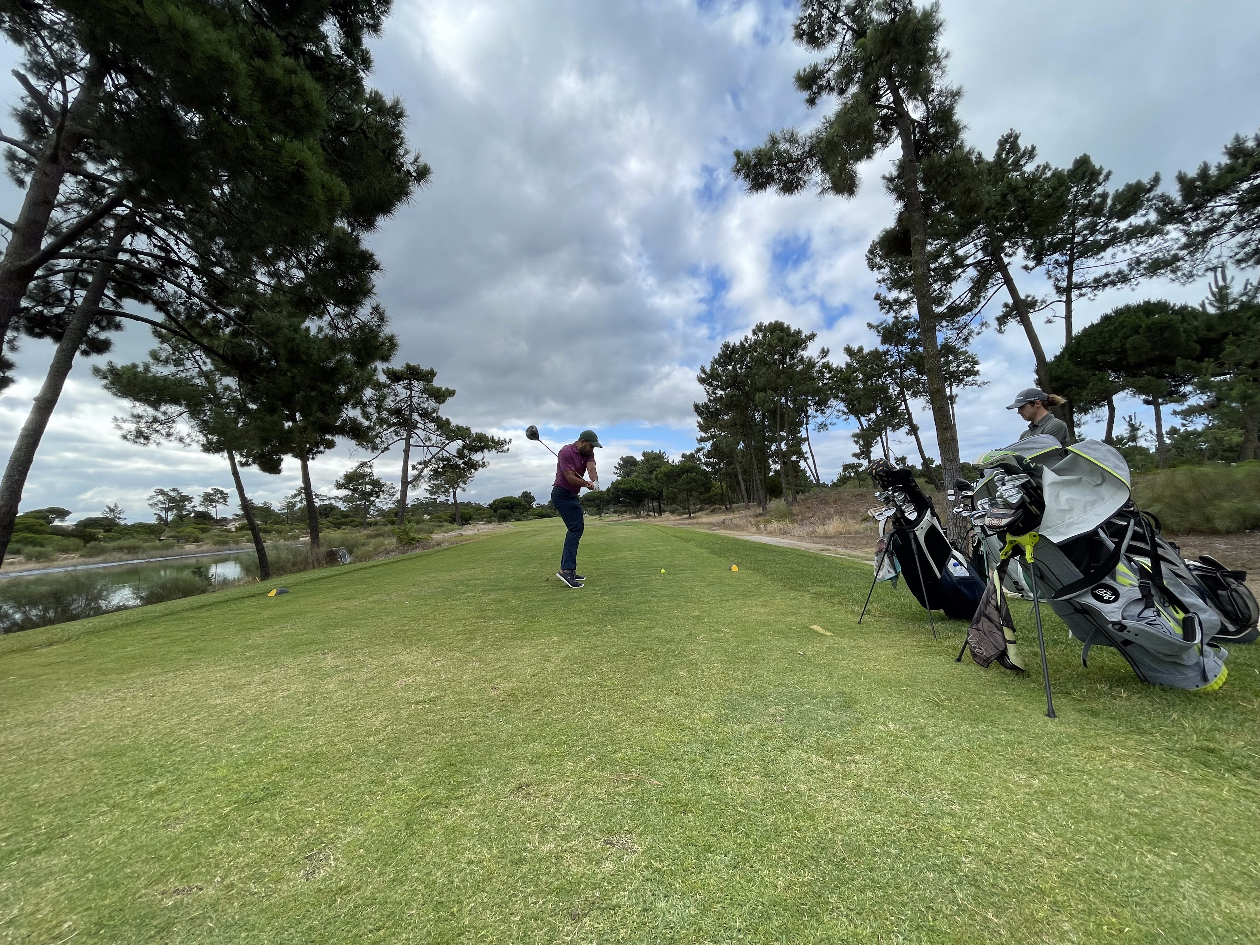 Golfer playing a shot on a sunlit course, part of a new generation taking up the game