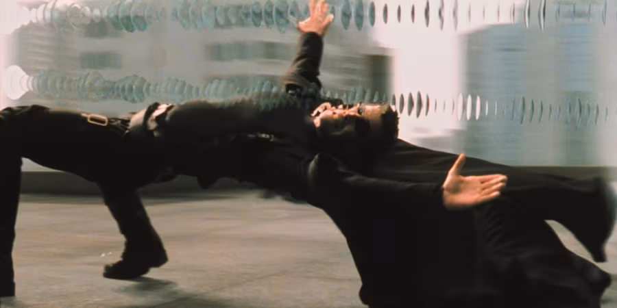 The Matrix's Neo dodging a bullet