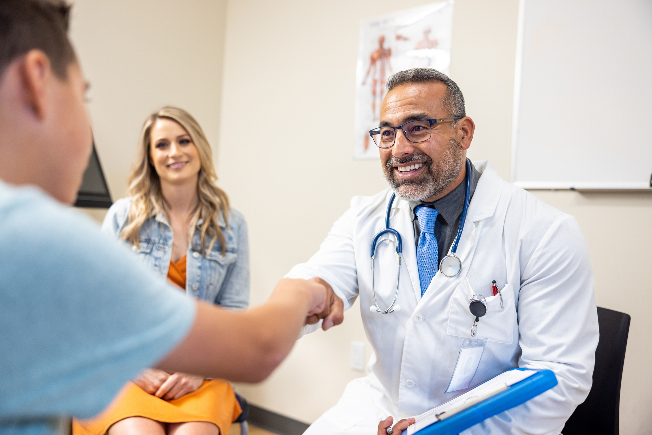 Doctor with patients in office setting