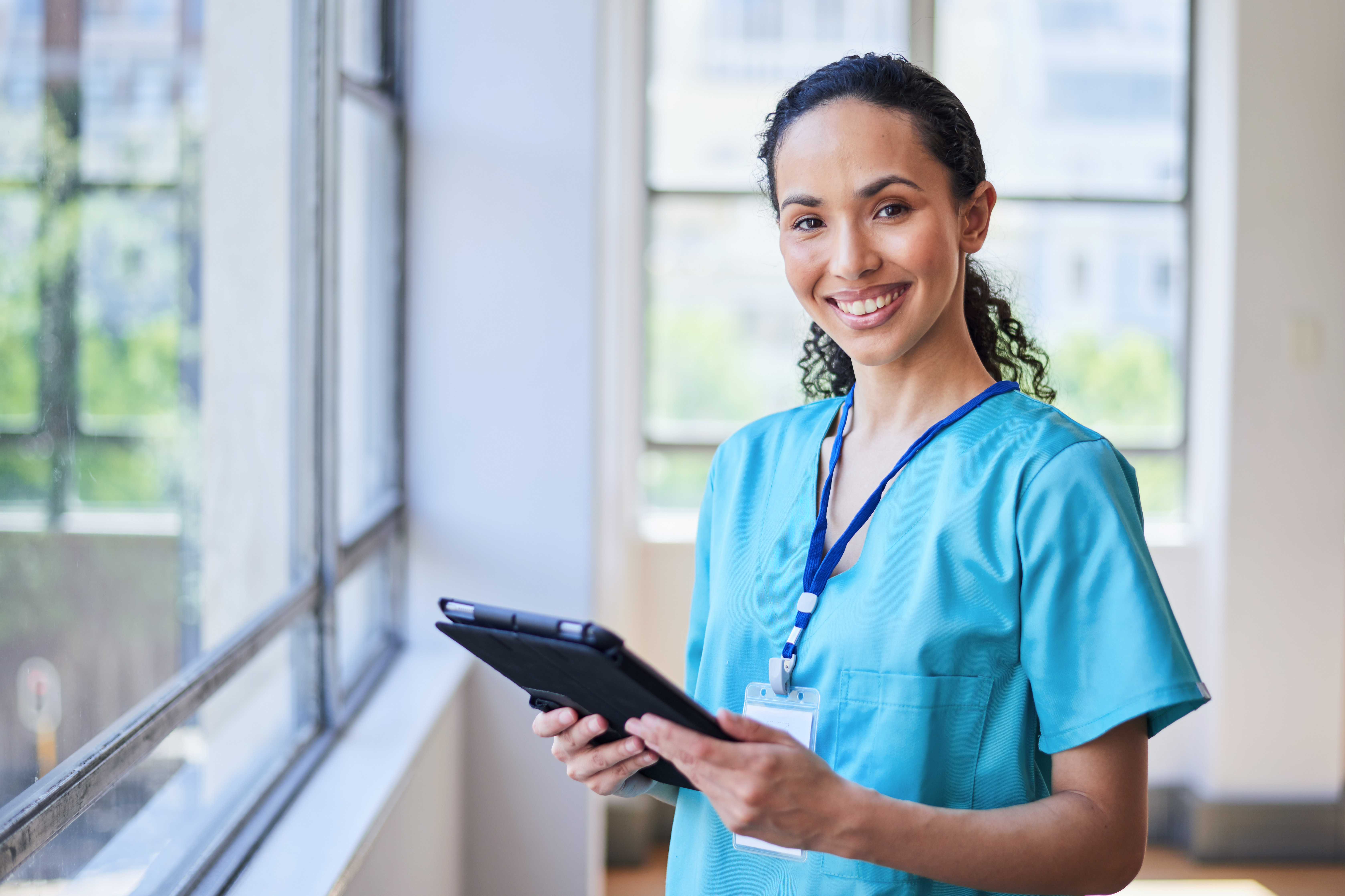 Nurse practitioner smiling in hospital setting