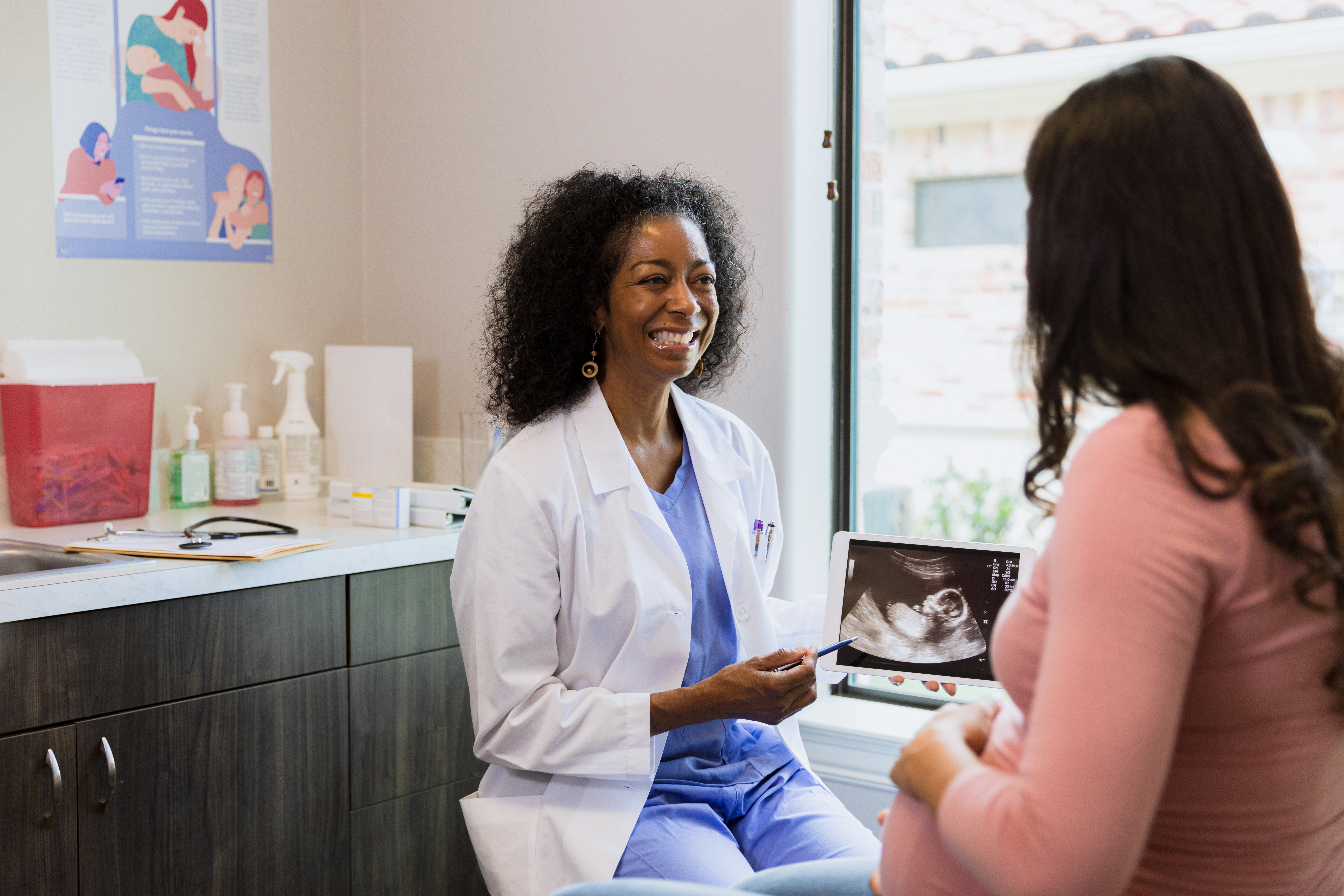 OB-GYN with a patient