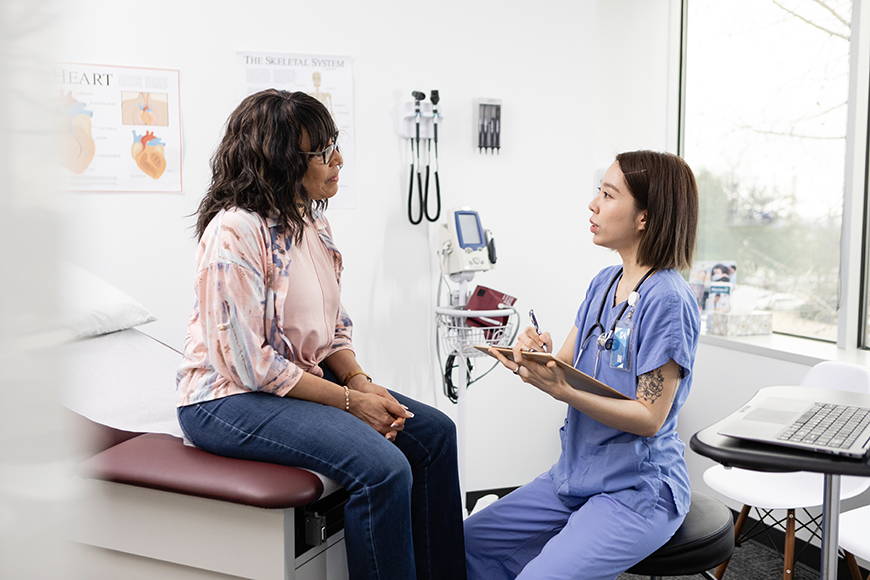 Urologist with patient