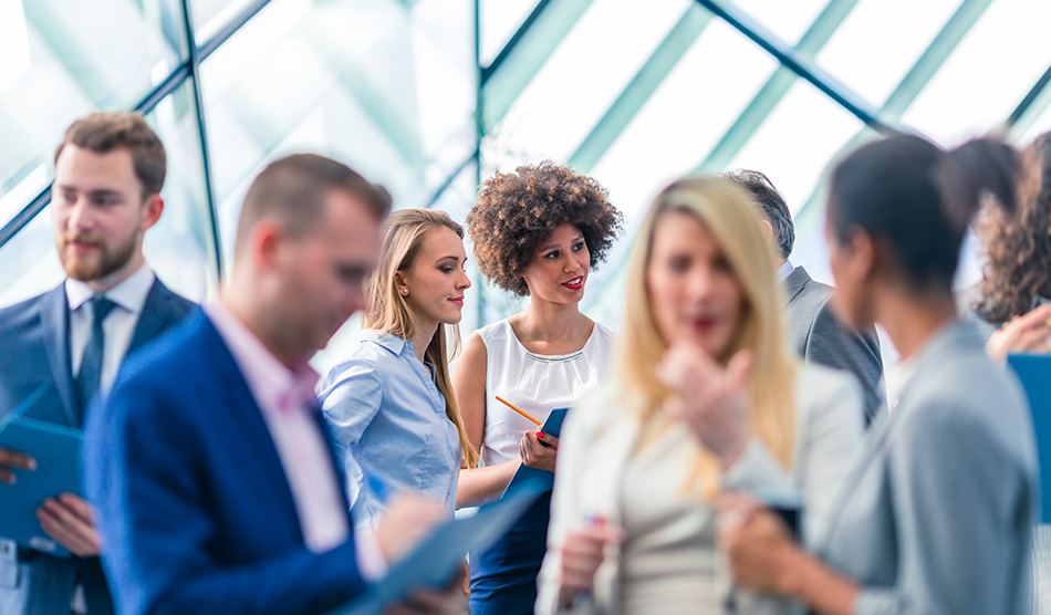 People speaking in a crowd