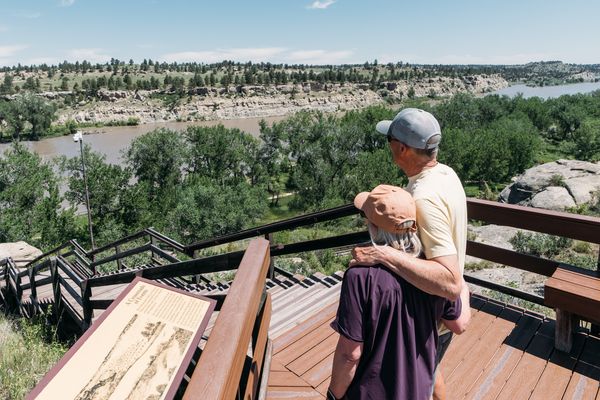 Couple looking at landscape from overlook