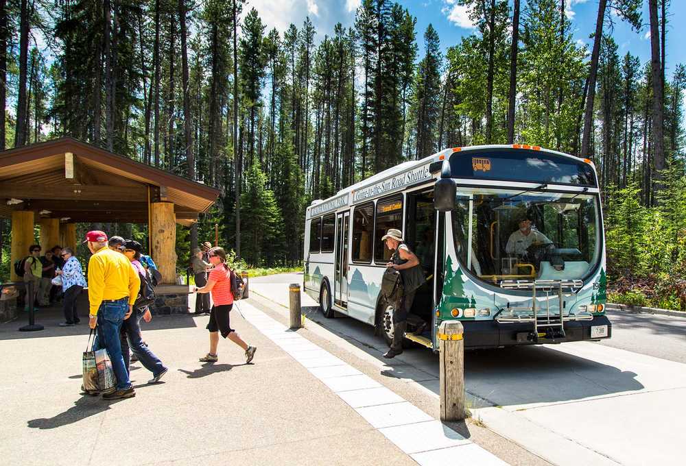 Passengers exiting the Going-to-the-Sun-Road Shuttle in Glacier National Park, Montana