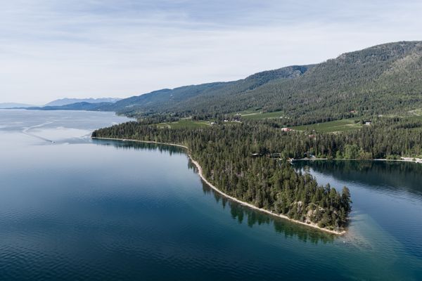 Yellow Bay State Park surrounded by clear blue water.