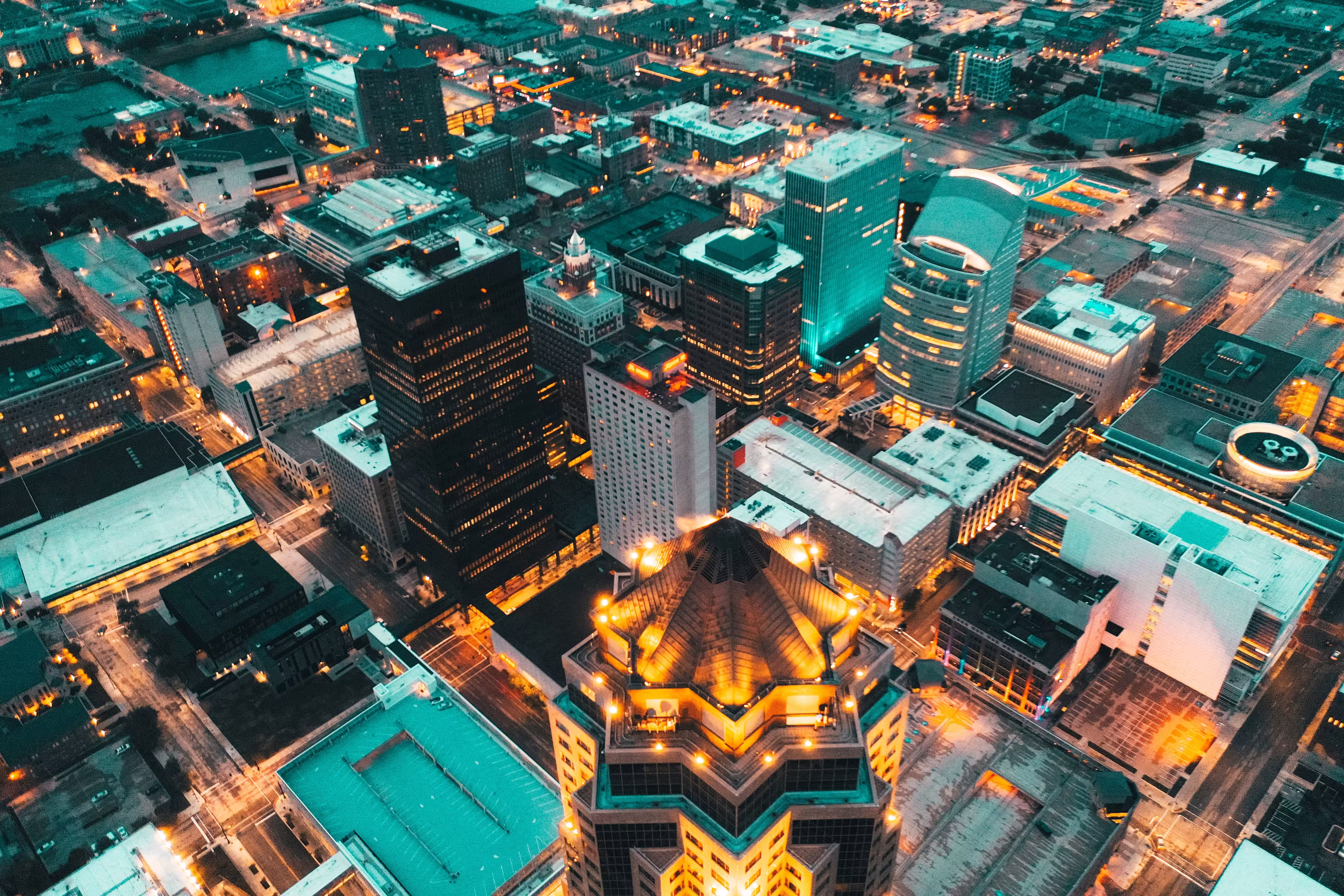 Night aerial view of downtown Iowa City, Iowa, with illuminated streets and buildings.