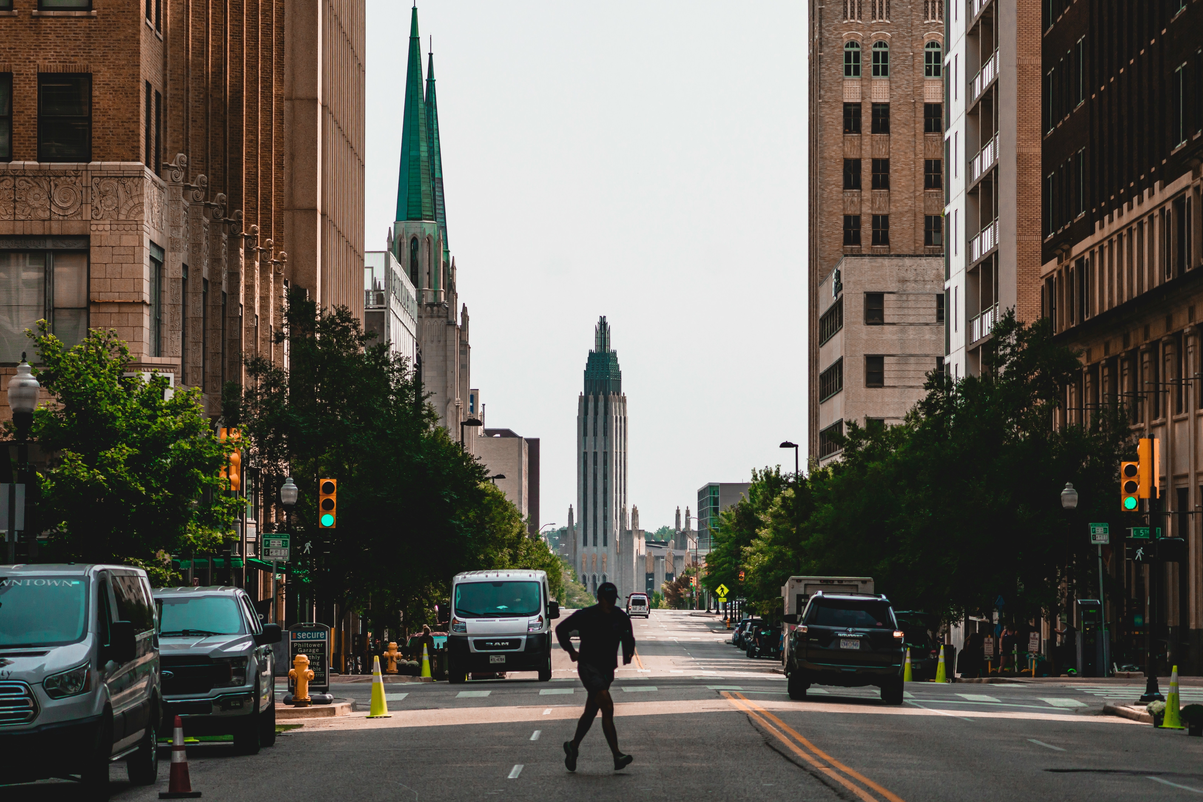 Street in Tulsa, with man jogging over the street in downtown Tulsam Oklahoma