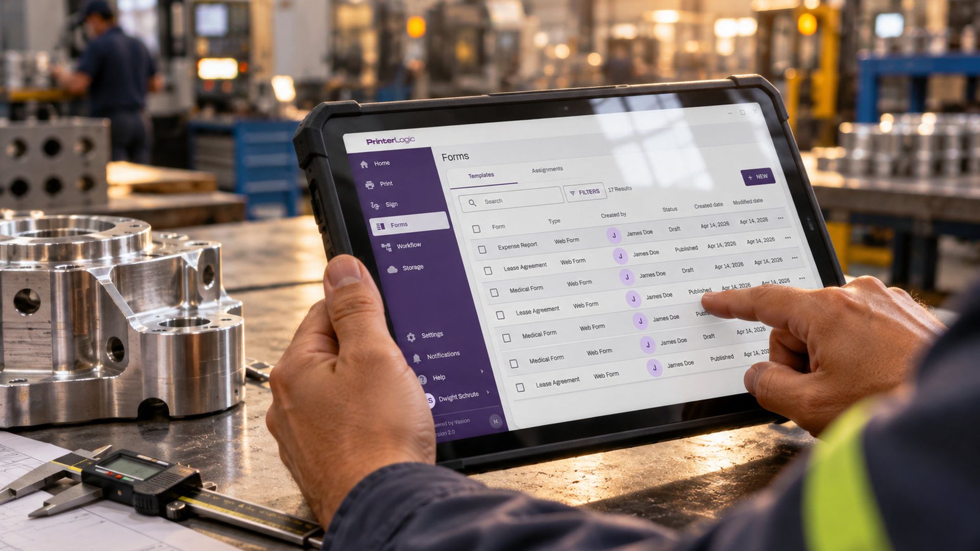 Manufacturing production manager reviewing print workflows on a tablet