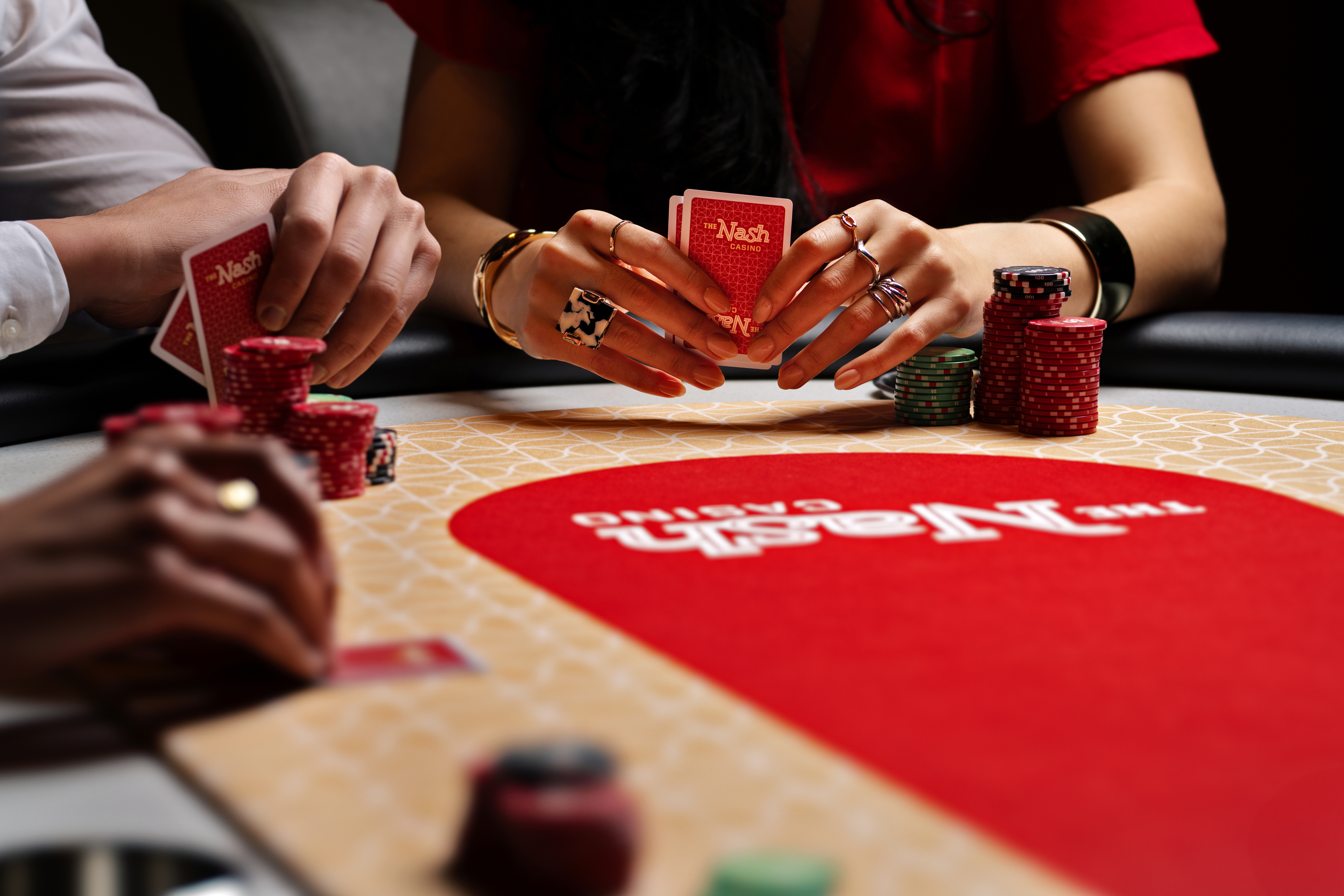Players enjoying a game of poker at The Nash Casino