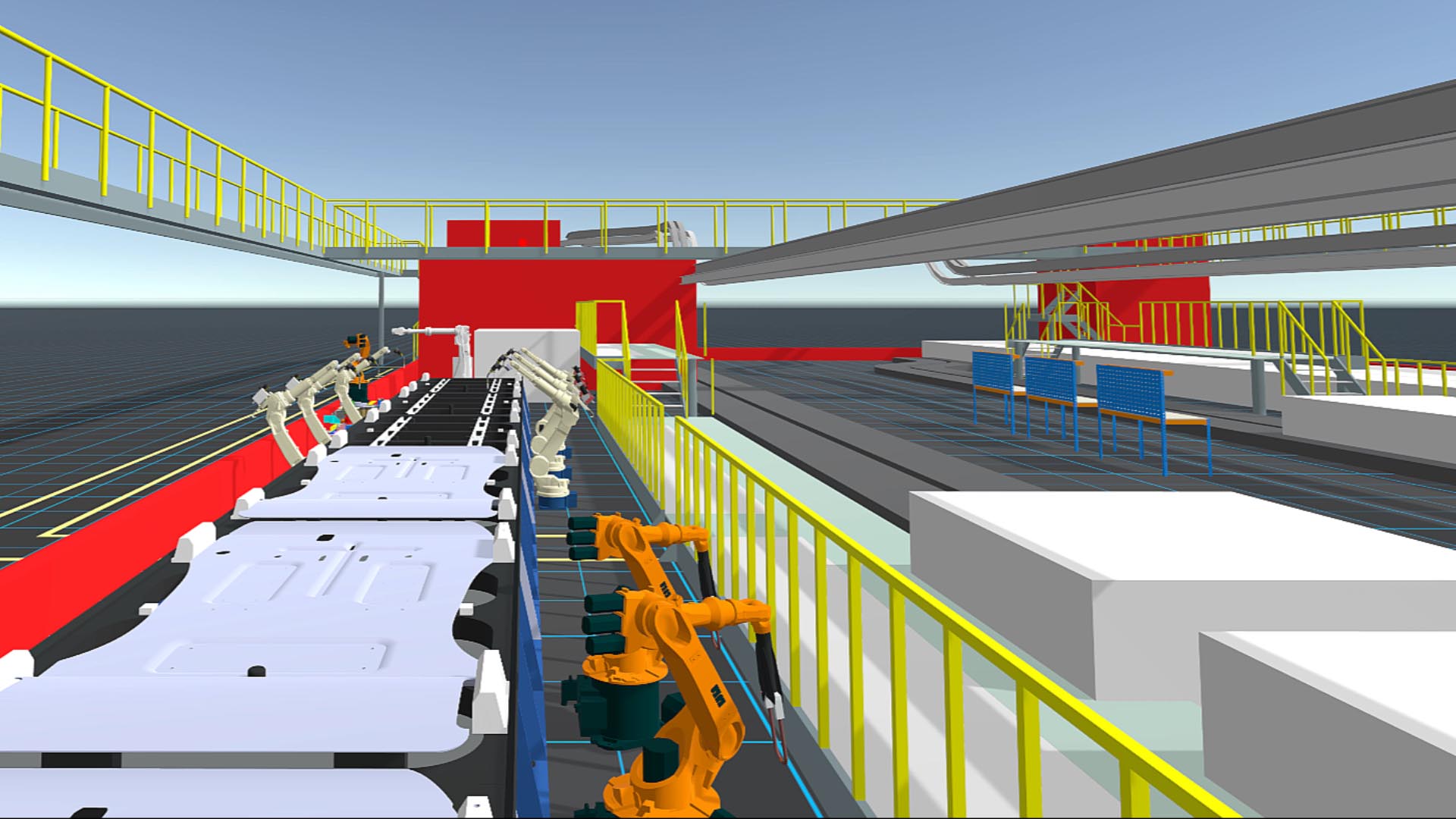Birds eye view of a VR factory interior with robotic arms, conveyor belts, and machinery. Yellow railings and red structures are visible under a blue sky.
