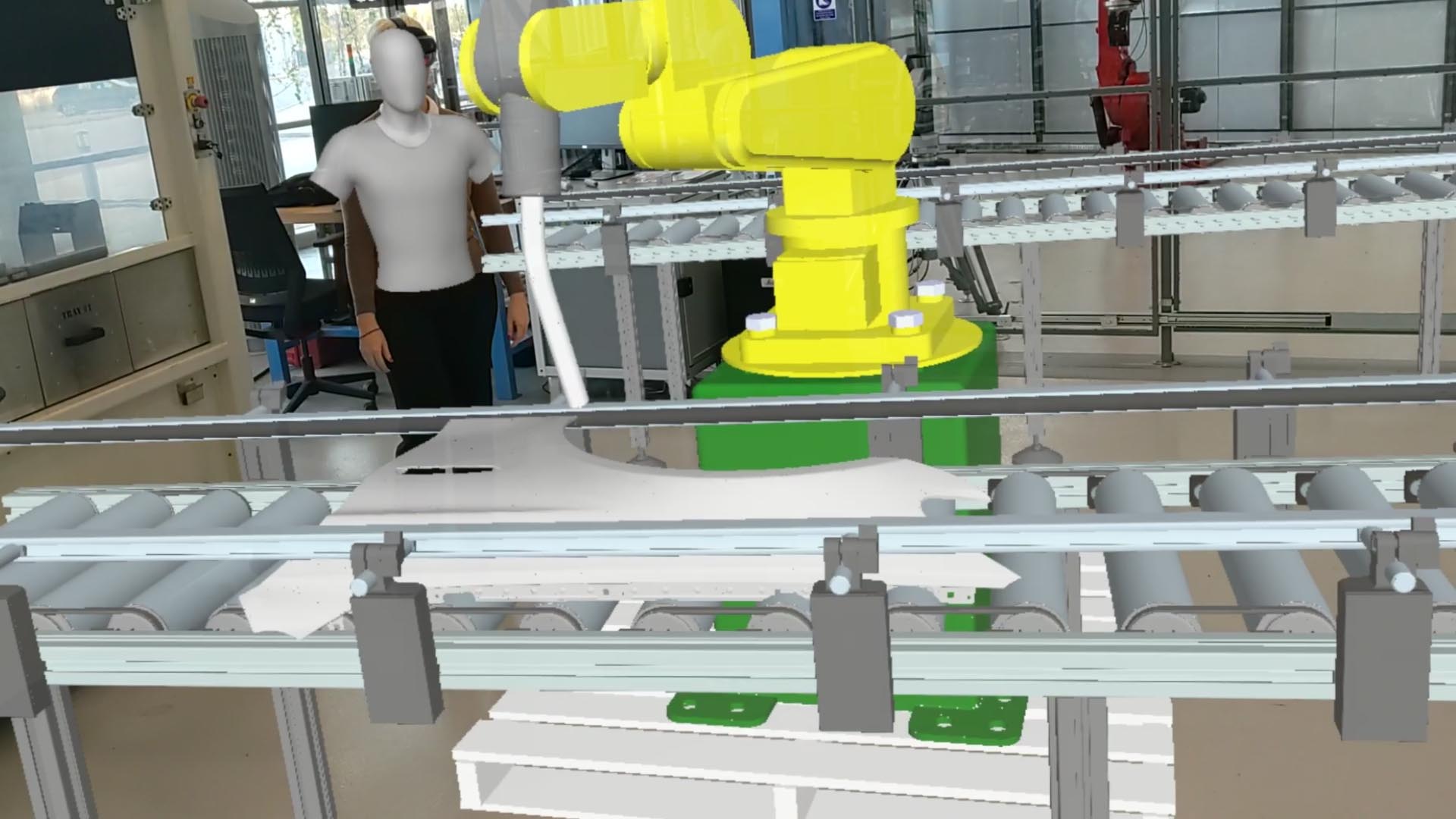 A virtual robot in a factory layout using Augmented and Mixed Reality