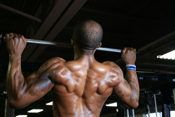 man doing pull ups - How Many Pull Ups Can the Average Person Do