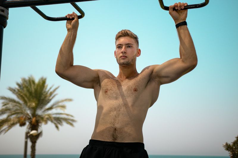 man working out - Pull-Up Strength Standards