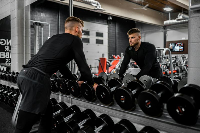 man in a gym - Weightlifting Standards
