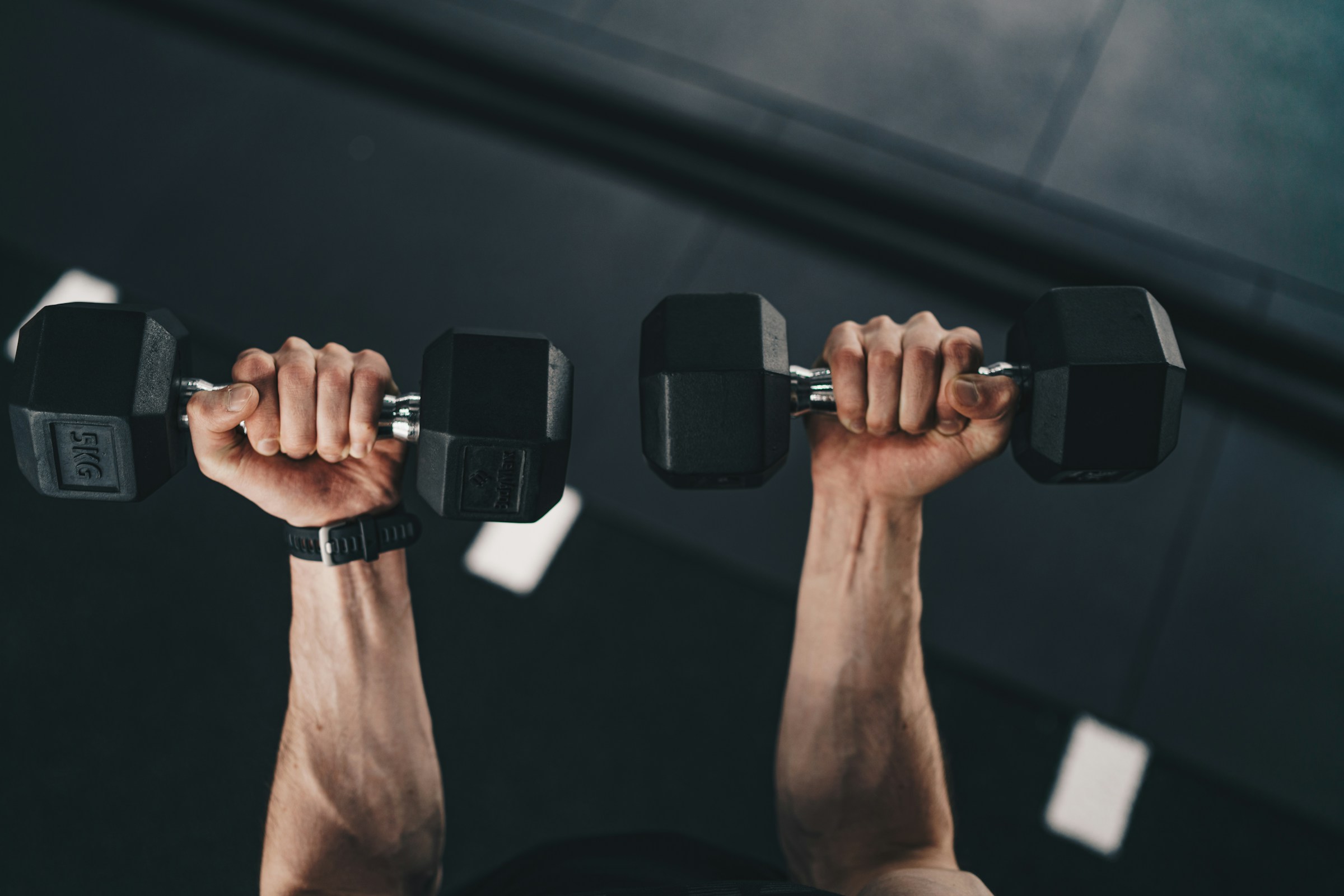 man holding dumbbells - Average Incline Dumbbell Press