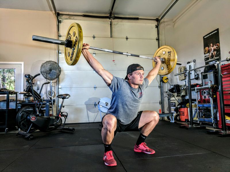 man with barbell - Weightlifting Standards