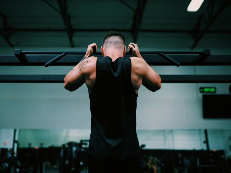man in a gym - How Many Pull-Ups Can the Average Person Do