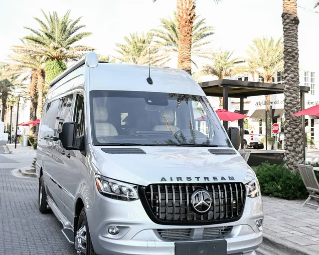 Airstream Tommy Bahama Touring Coach in front of Palsm Trees|Airstream 19GT Touring Coach Tommy Bahama parked at a beach|Airstream 19GT Touring Coach Tommy Bahama parked at a beach|Airstream Touring Coach 24GL Tommy Bahama Decor|Airstream 2026 Tommy Bahama 24GT Touring Coach Interior Floorplan|Airstream Tommy Bahama Interstate 19GT Touring Coach at a beach|Airstream Tommy Bahama Resort Atlas Touring Coach Floorplan Image|Airstream Atlas Touring Coach Tommy Bahama Cockpick interior|Airstream Touring Coach Interstate 24GL Galley in Tommy Bahama Decor|Airstream Touing Coach interior of the Interstate 19GT Tommy Bahama Decor with Accessory Kit|Inside the Airstream Touring Coach Interstate 24GL in the Dining Area.|Interior of the Airstream Tommy Bahama Touring Coach Interstate 24GL|Airstream Tommy Bahama Touring Coach Interstate 24GL|Airstream Touring Coach interior of the Interstate 19GT Tommy Bahama Decor with Accessory Kit