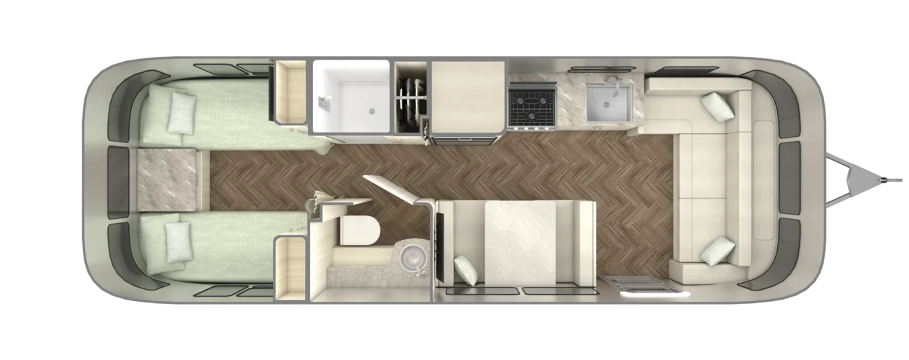 A detailed floor plan of a camper, featuring twin beds, a central bathroom, kitchen, and living area with a sofa and dining table.