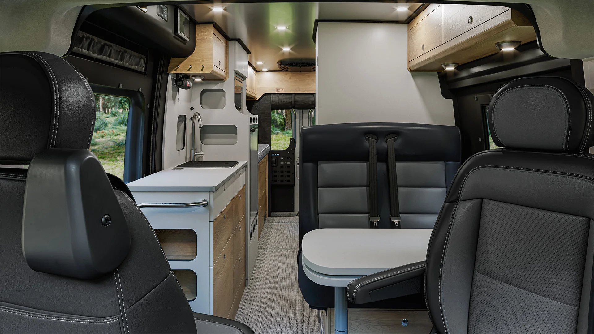 Interior of a modern camper van with sleek black seats, a compact kitchenette, wooden cabinets, and ambient lighting.