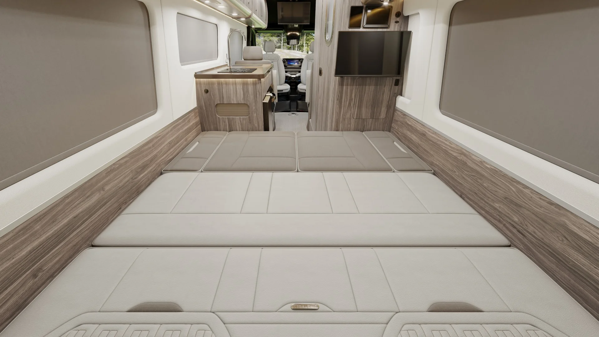 Camper van two-toned lounge couch converted into a bed sleeping space