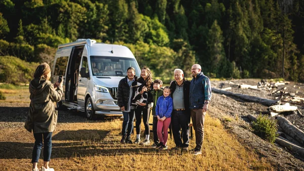 Family enjoying time together outside their Airstream