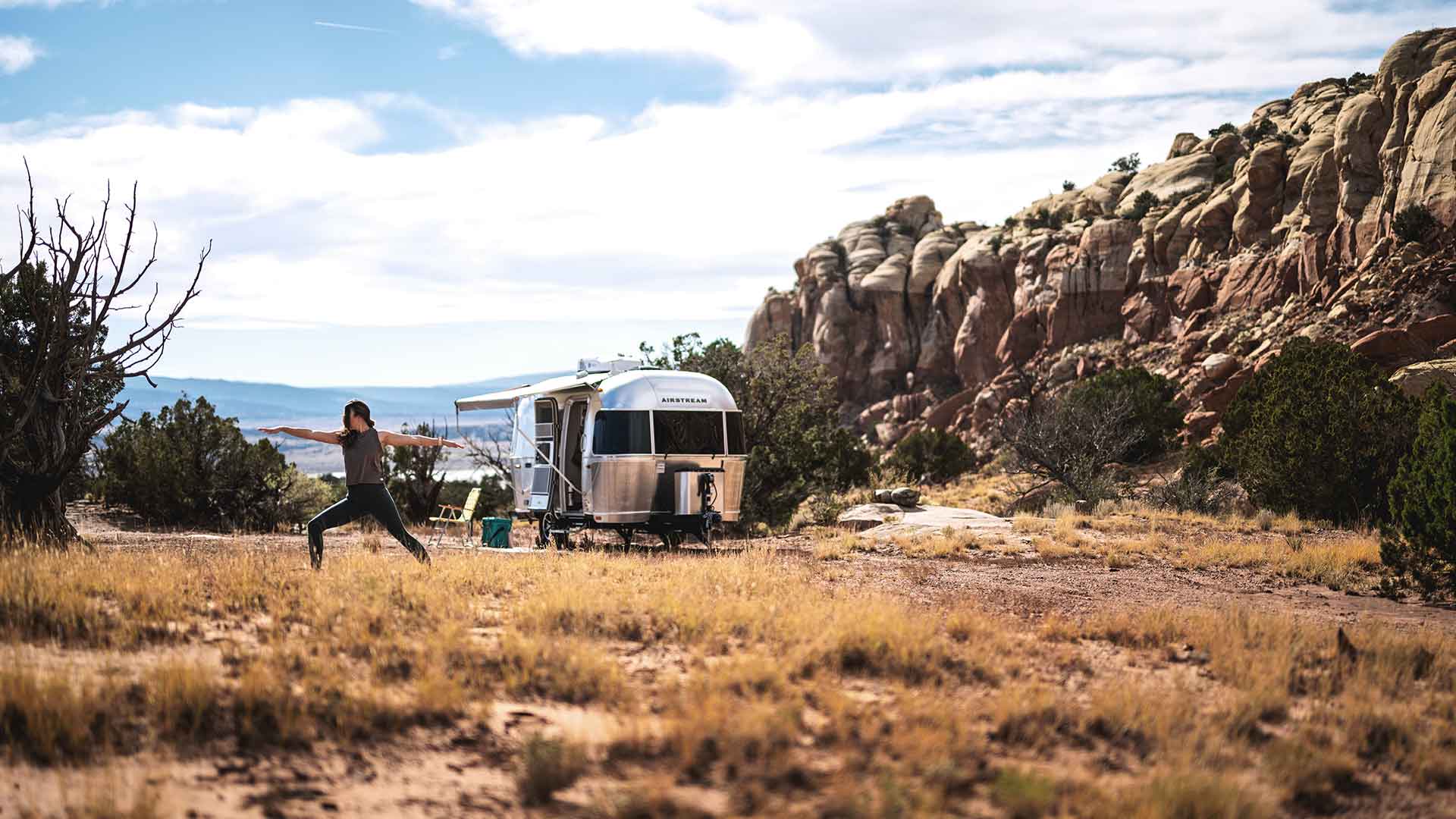 Caravel-Yoga-Dessert|Caravel-Exterior-Relaxng-dessert|airstream-interstate-19x-solo-women-adventure