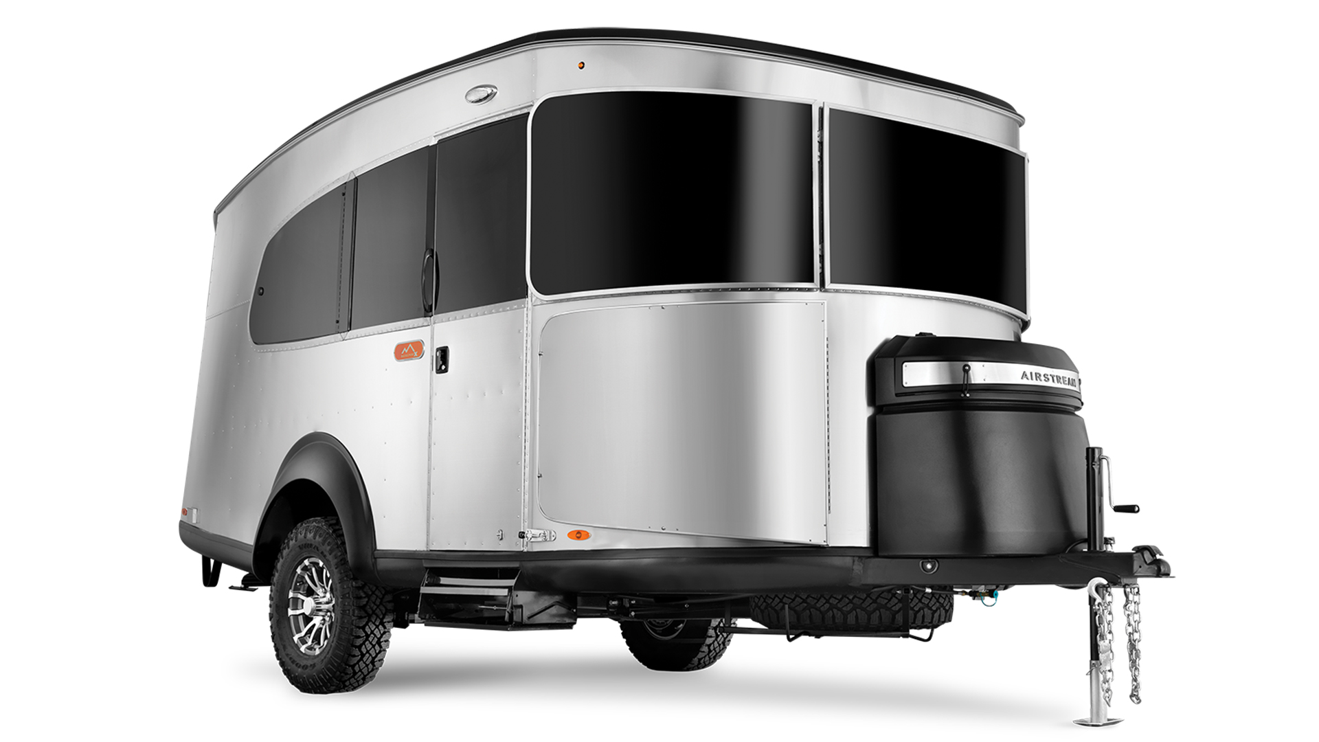 Sleek, silver travel trailer with tinted windows, raised on a trailer hitch with a black front storage compartment.