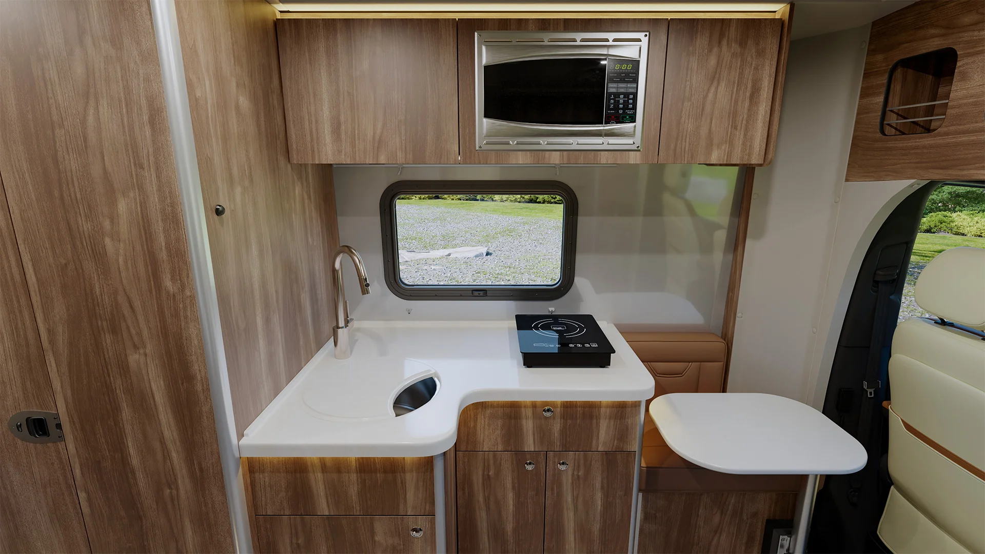 Compact camper van kitchen with wood cabinets, microwave, sink, induction cooktop, and window view. Simple and modern design.