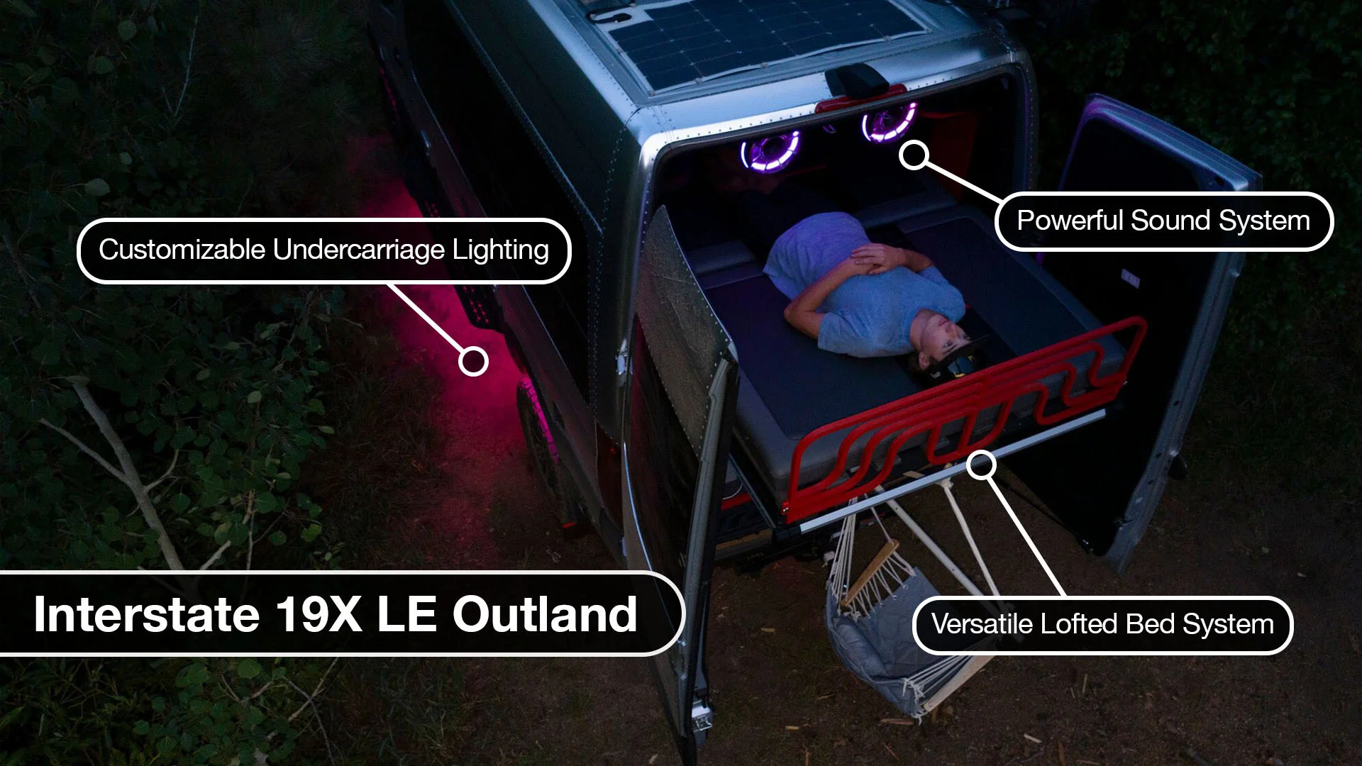 Overhead view of a person lying in an open van bed, featuring customizable lighting, powerful sound system, and versatile lofted bed.