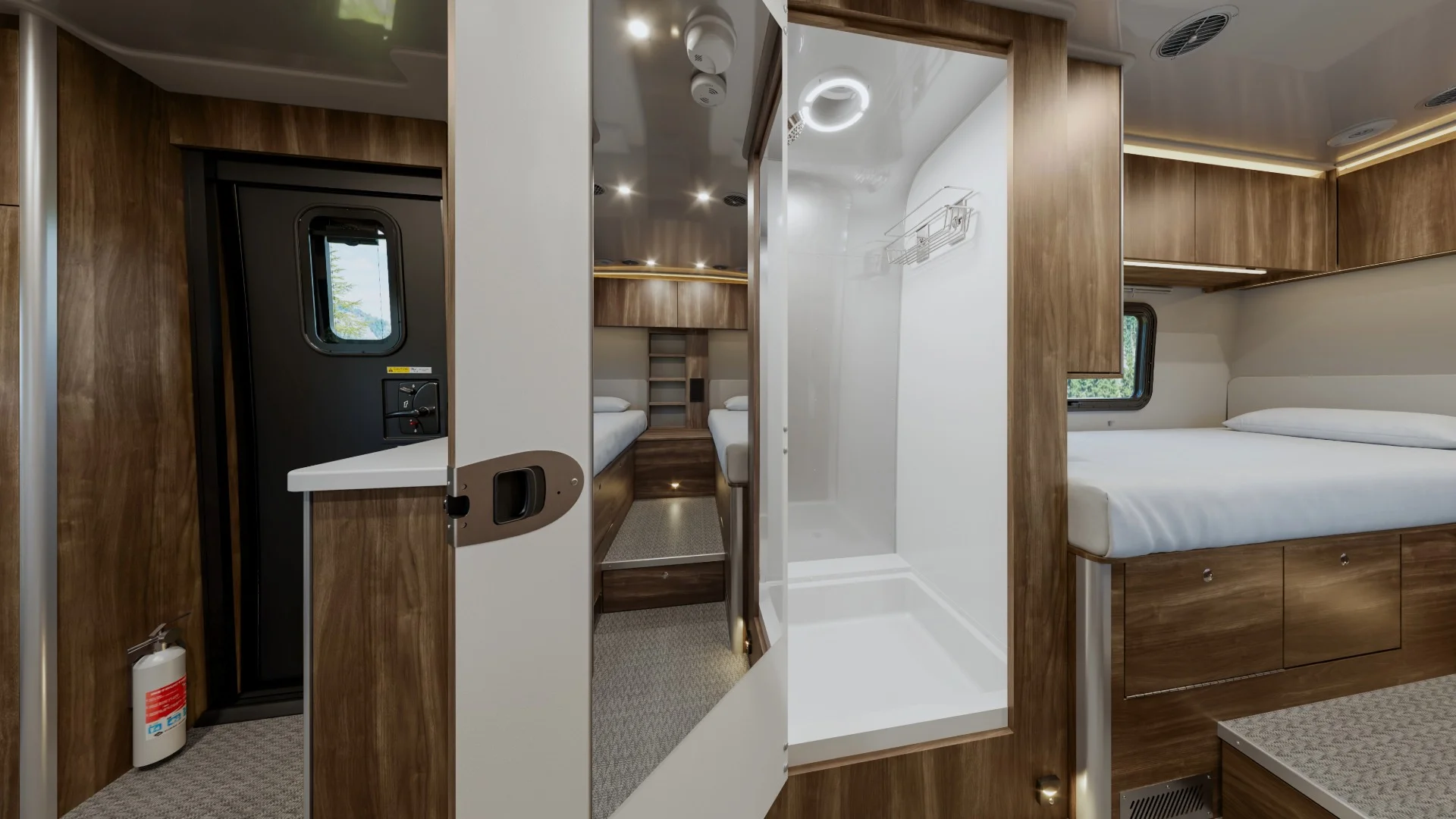 Interior of a modern camper with wood finish, showing a bed, shower, cabinets, and fire extinguisher. Cozy and compact design.